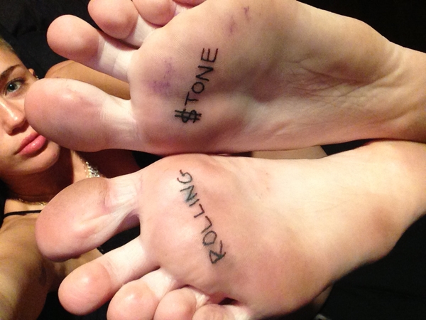 Miley Cyrus loves to get inked... even under her feet!